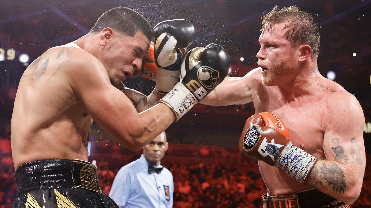 LAS VEGAS, NEVADA - SEPTEMBER 14: WBC/WBA/WBO super middleweight champion Canelo Alvarez (R) punches Edgar Berlanga during the ninth round of a title fight at T-Mobile Arena on September 14, 2024 in Las Vegas, Nevada.