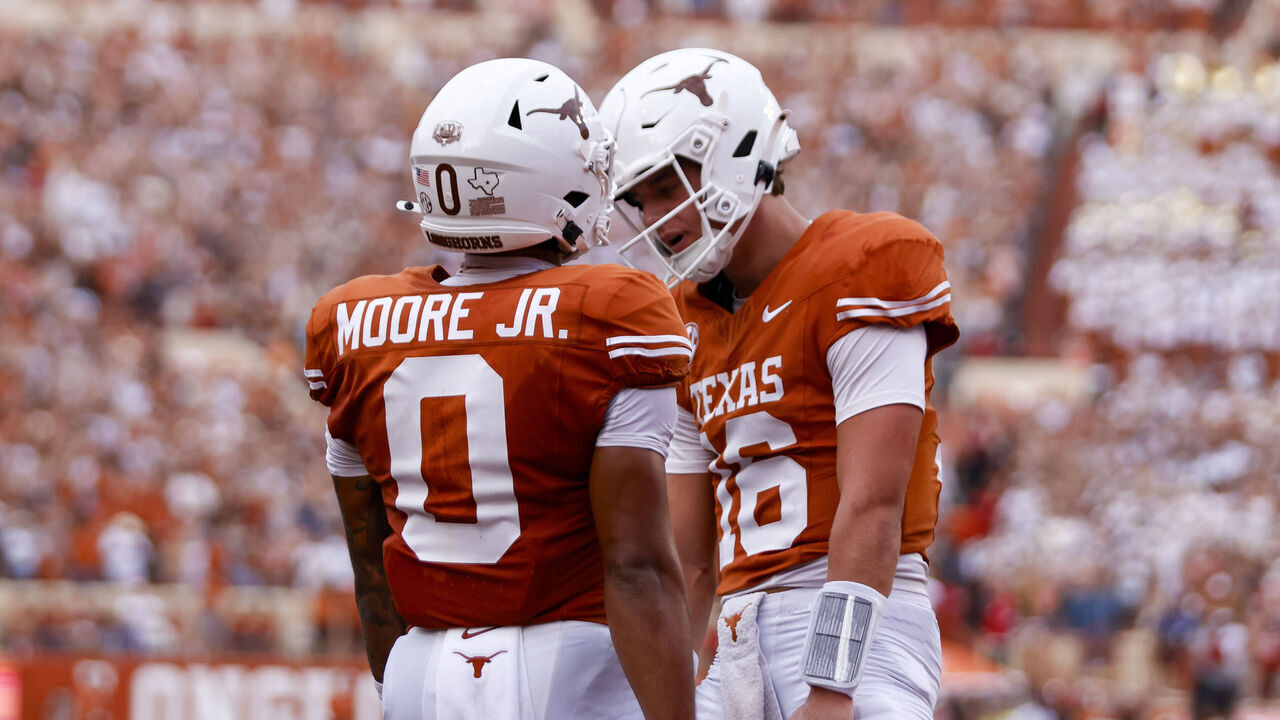AUSTIN, TX - SEPTEMBER 14: Texas Longhorns quarterback Arch Manning (16)(R) celebrates with Texas Longhorns wide receiver DeAndre Moore Jr. (0)(L) after Moore scores a touchdown during the first half of the game against the UTSA Roadrunners on September 14, 2024, at Darrell K Royal - Texas Memorial Stadium in Austin, TX.