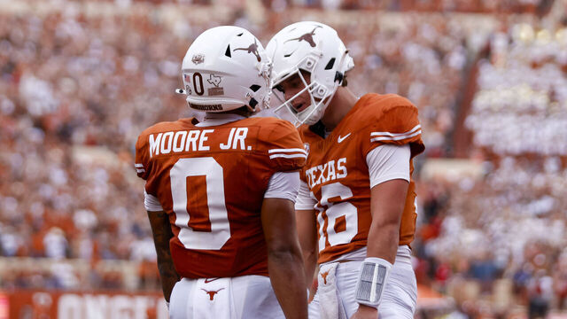 AUSTIN, TX - SEPTEMBER 14: Texas Longhorns quarterback Arch Manning (16)(R) celebrates with Texas Longhorns wide receiver DeAndre Moore Jr. (0)(L) after Moore scores a touchdown during the first half of the game against the UTSA Roadrunners on September 14, 2024, at Darrell K Royal - Texas Memorial Stadium in Austin, TX.