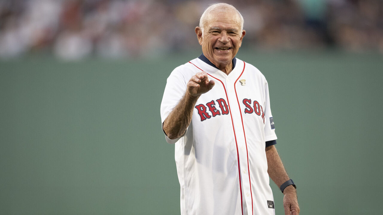 BOSTON, MA - JULY 28: Broadcaster Joe Castiglione reacts throws a ceremonial first pitch recognizing his receipt of the National Baseball Hall of Fame 2024 Ford C. Frick Award before a game between the New York Yankees and the Boston Red Sox on July 28, 2024 at Fenway Park in Boston, Massachusetts.