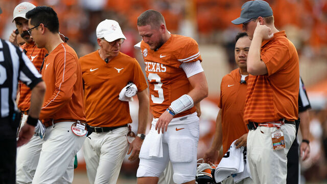 AUSTIN, TEXAS - SEPTEMBER 14: Quinn Ewers #3 of the Texas Longhorns is tended to by medical staff after an injury in the second quarter against the UTSA Roadrunners at Darrell K Royal-Texas Memorial Stadium on September 14, 2024 in Austin, Texas.