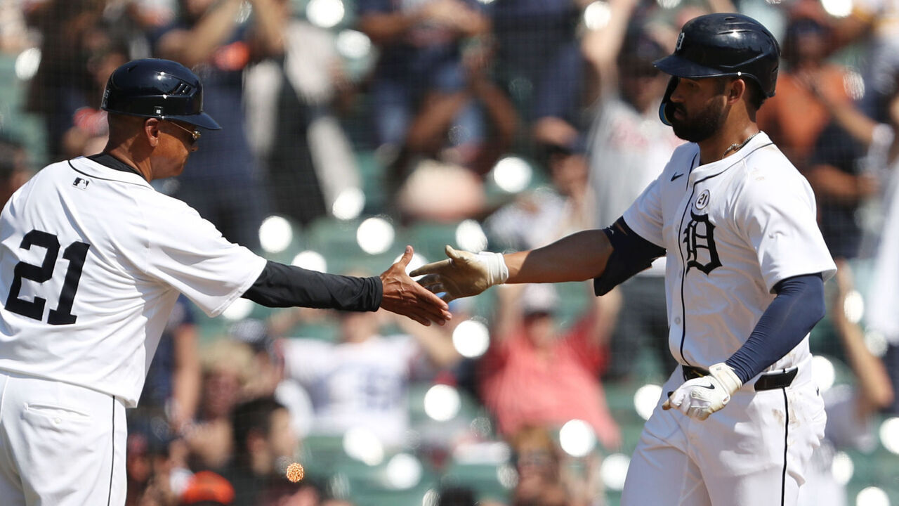 DETROIT, MICHIGAN - SEPTEMBER 15: Riley Greene #31 of the Detroit Tigers celebrates with the third base coach Joey Cora after hitting a solo home run during the eighth inning against the Baltimore Orioles at Comerica Park on September 15, 2024 in Detroit, Michigan.