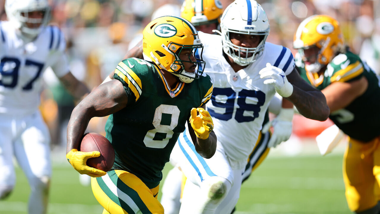 GREEN BAY, WISCONSIN - SEPTEMBER 15: Josh Jacobs #8 of the Green Bay Packers runs with the ball against the Indianapolis Colts during the second quarter at Lambeau Field on September 15, 2024 in Green Bay, Wisconsin.