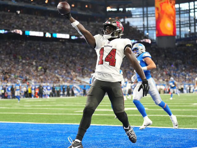 DETROIT, MICHIGAN - SEPTEMBER 15: Chris Godwin #14 of the Tampa Bay Buccaneers celebrates after scoring a touchdown against the Detroit Lions during the second quarter at Ford Field on September 15, 2024 in Detroit, Michigan.