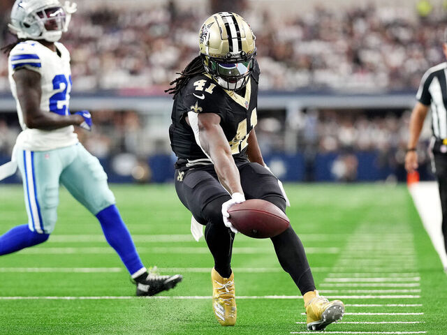 ARLINGTON, TEXAS - SEPTEMBER 15: Alvin Kamara #41 of the New Orleans Saints scores a touchdown during the second quarter at AT&T Stadium on September 15, 2024 in Arlington, Texas.