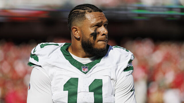 SANTA CLARA, CA - SEPTEMBER 9: Linebacker Jermaine Johnson #11 of the New York Jets stands on the sidelines during the national anthem prior an NFL football game against the San Francisco 49ers, at Levi's Stadium on September 9, 2024 in Santa Clara, California.