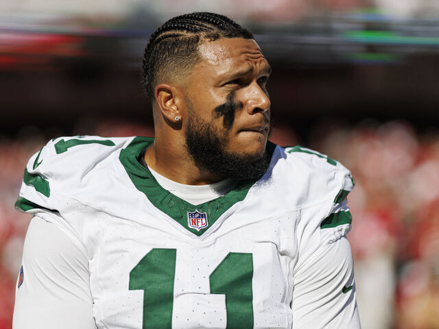 SANTA CLARA, CA - SEPTEMBER 9: Linebacker Jermaine Johnson #11 of the New York Jets stands on the sidelines during the national anthem prior an NFL football game against the San Francisco 49ers, at Levi's Stadium on September 9, 2024 in Santa Clara, California.