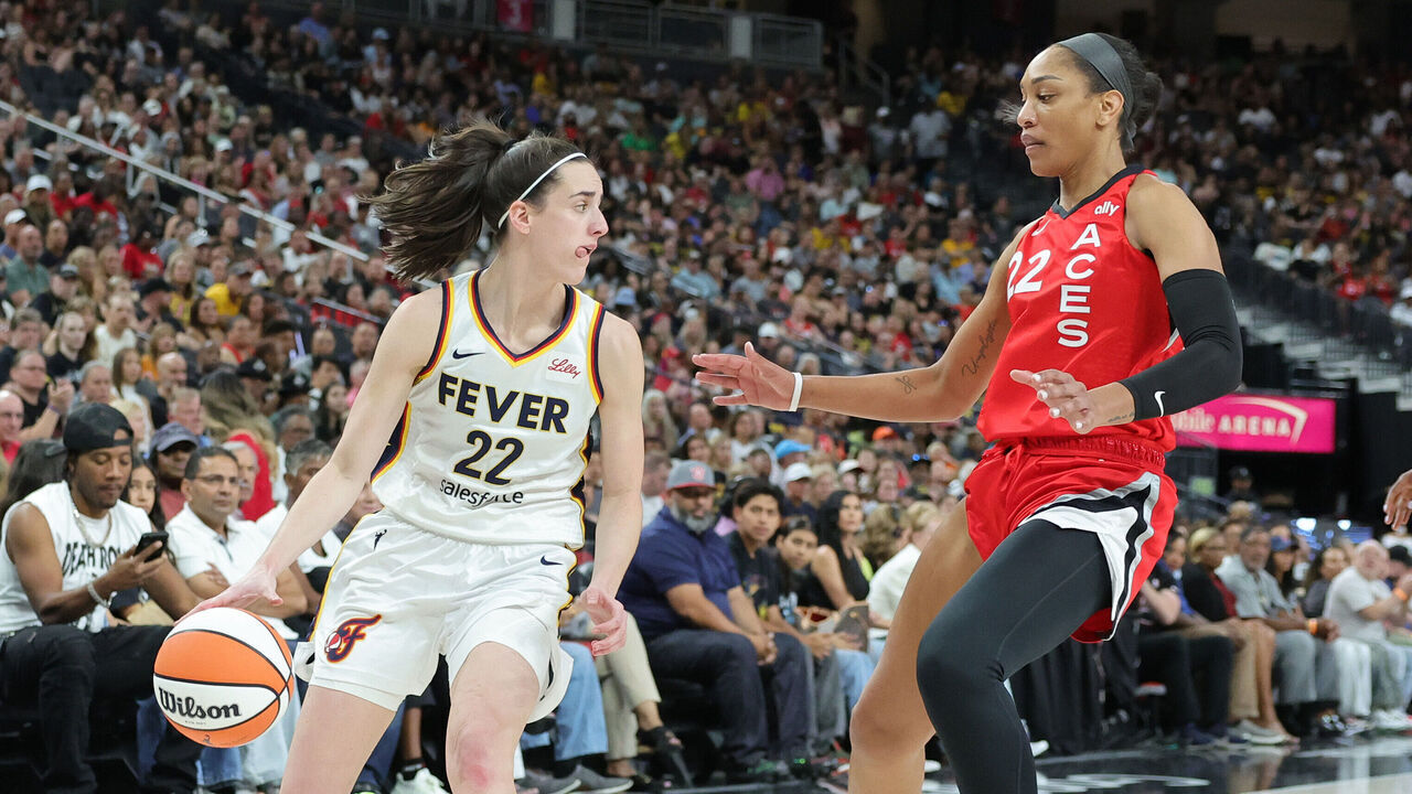 LAS VEGAS, NEVADA - JULY 02: Caitlin Clark #22 of the Indiana Fever is guarded by A'ja Wilson #22 of the Las Vegas Aces in the first quarter of their game at T-Mobile Arena on July 02, 2024 in Las Vegas, Nevada.