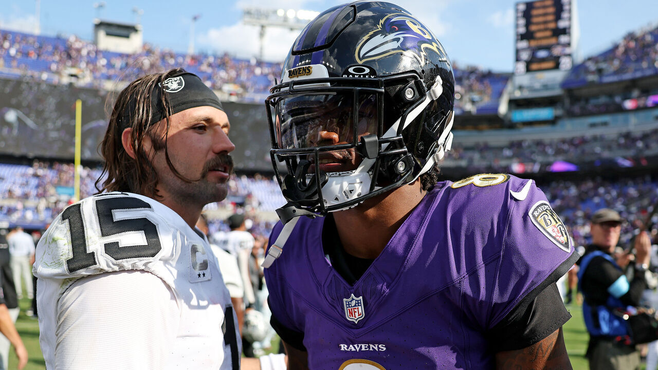 BALTIMORE, MARYLAND - SEPTEMBER 15: Gardner Minshew II #15 of the Las Vegas Raiders and Lamar Jackson #8 of the Baltimore Ravens talk after the game at M&T Bank Stadium on September 15, 2024 in Baltimore, Maryland.