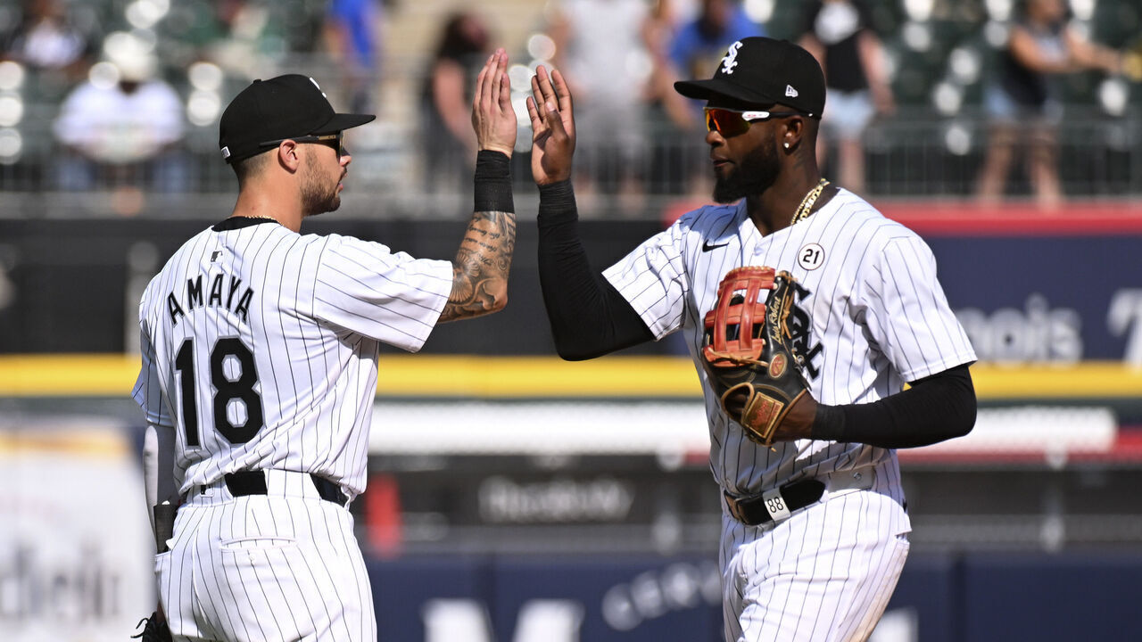 CHICAGO, ILLINOIS - SEPTEMBER 15: Jacob Amaya #18 and Luis Robert Jr. #88 of the Chicago White Sox celebrate their team win over the Oakland Athletics at Guaranteed Rate Field on September 15, 2024 in Chicago, Illinois. The White Sox defeated the Athletics 4-3.