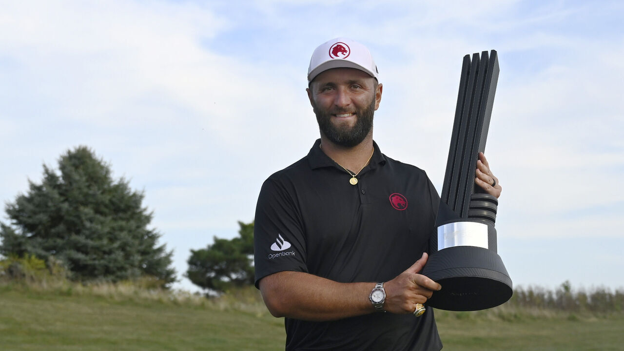 BOLINGBROOK, ILLINOIS - SEPTEMBER 15: Jon Rahm, Spain, of the Legion XIII poses with the trophy after winning LIV Golf: Chicago at Bolingbrook Golf Club on September 15, 2024 in Bolingbrook, Illinois.