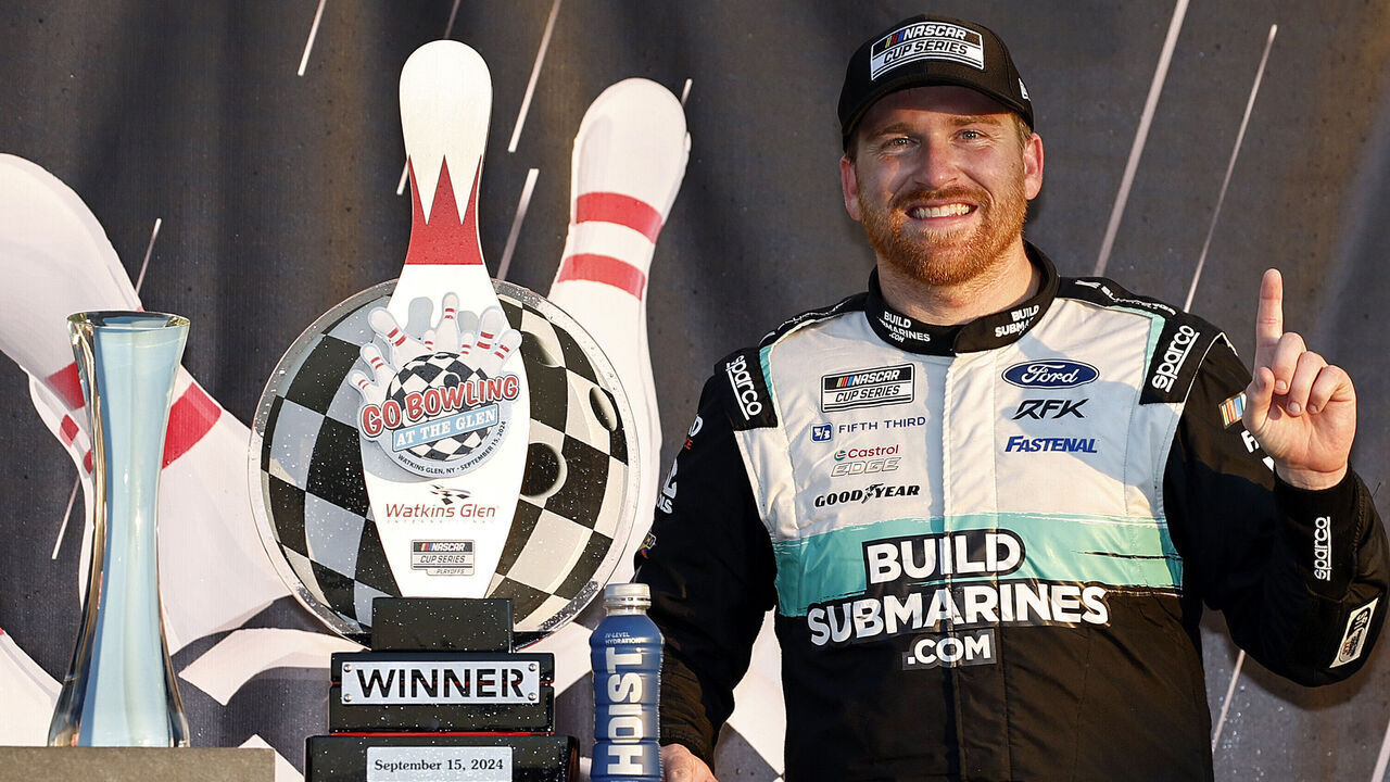 WATKINS GLEN, NEW YORK - SEPTEMBER 15: Chris Buescher, driver of the #17 BuildSubmarines.com Ford, celebrates in victory lane after winning the NASCAR Cup Series Go Bowling at The Glen at Watkins Glen International on September 15, 2024 in Watkins Glen, New York.