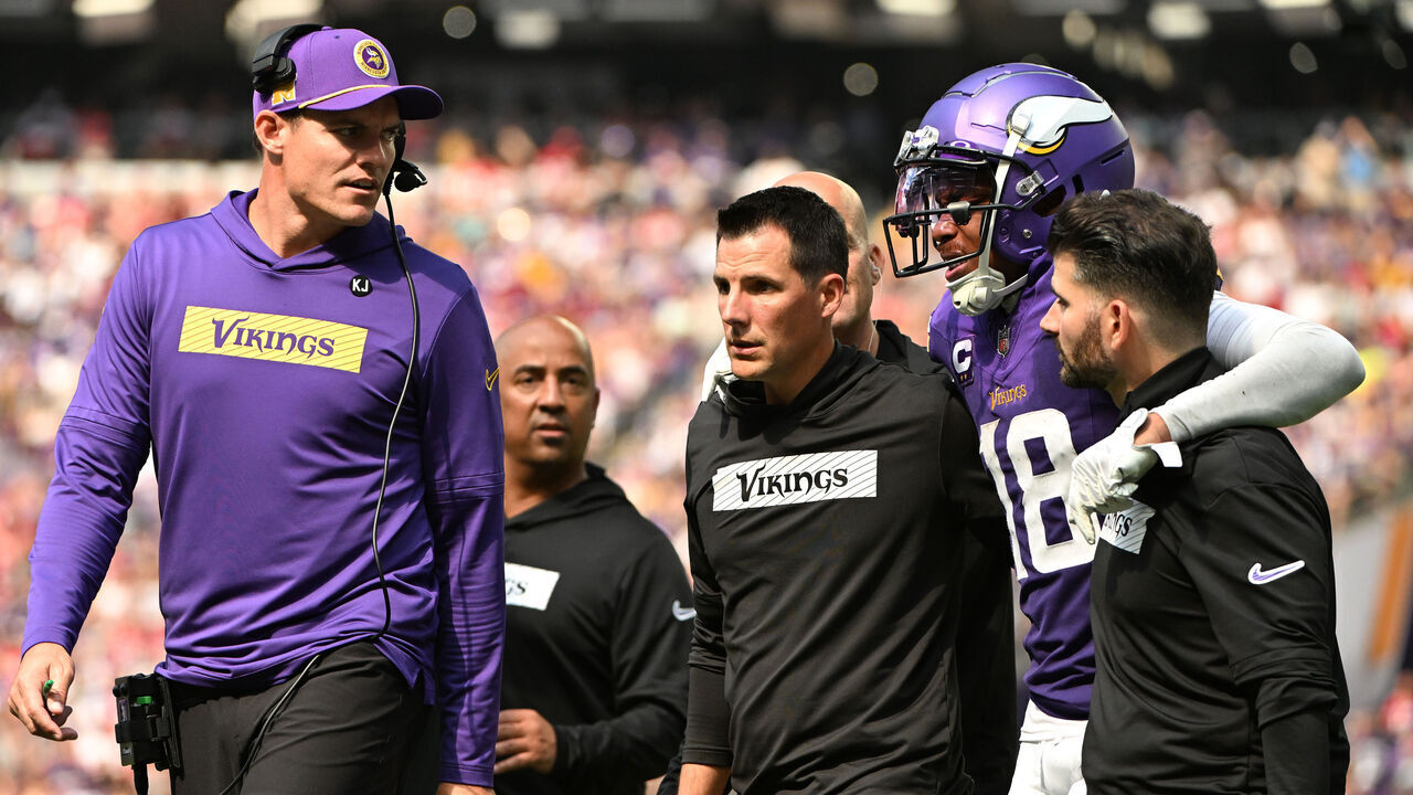 MINNEAPOLIS, MINNESOTA - SEPTEMBER 15: Justin Jefferson #18 of the Minnesota Vikings is helped off the field against the San Francisco 49ers during the third quarter at U.S. Bank Stadium on September 15, 2024 in Minneapolis, Minnesota.