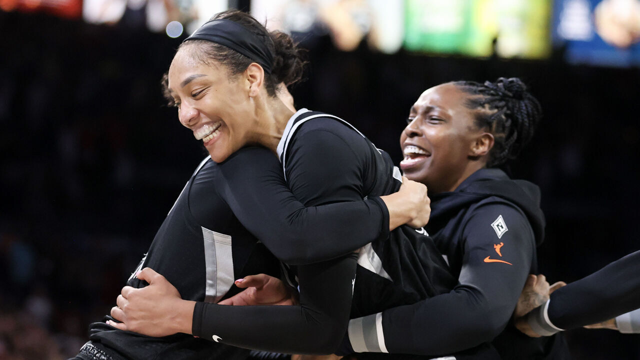 LAS VEGAS, NEVADA - SEPTEMBER 15: A'ja Wilson #22 of the Las Vegas Aces celebrates with Chelsea Gray #12 of the Las Vegas Aces after Wilson became the first player in WNBA history to score 1000 points in a regular season during the fourth quarter against the Connecticut Sun in a game at Michelob ULTRA Arena on September 15, 2024 in Las Vegas, Nevada. The Aces won 84-71.