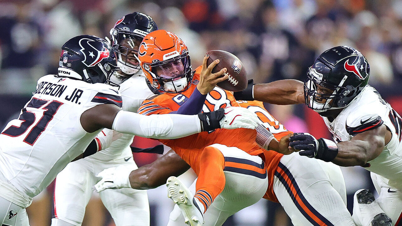 HOUSTON, TEXAS - SEPTEMBER 15: Quarterback Caleb Williams #18 of the Chicago Bears is sacked by Will Anderson Jr. #51 of the Houston Texans during the first quarter at NRG Stadium on September 15, 2024 in Houston, Texas.