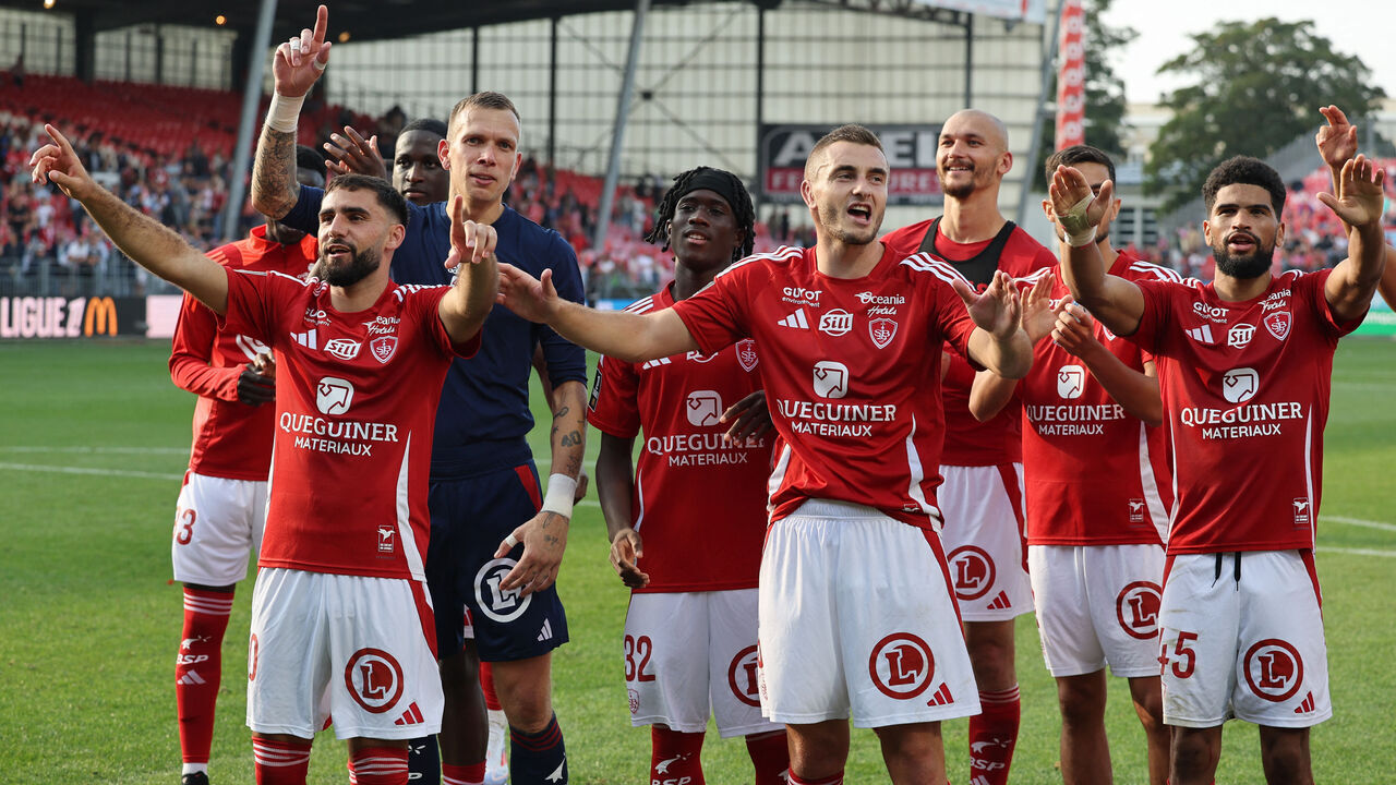 Brest's players celebrate their 4-0 win following the French L1 football match between Stade Brestois 29 (Brest) and Saint Etienne at Stade Francis-Le Ble in Brest, western France on August 31, 2024.