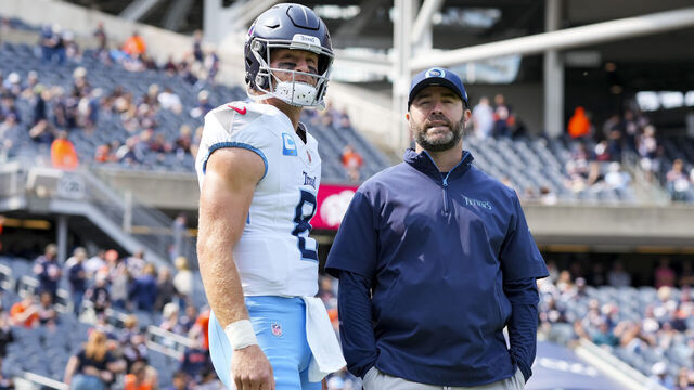 CHICAGO, IL - SEPTEMBER 8: Quarterback Will Levis #8 of the Tennessee Titans and head coach Brian Callahan stand on the field prior to an NFL football game against the Chicago Bears, at Soldier Field on September 8, 2024 in Chicago, Illinois.