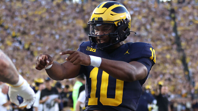 ANN ARBOR, MICHIGAN - AUGUST 31: Alex Orji #10 of the Michigan Wolverines celebrates a first half touchdown throw while playing the Fresno State Bulldogs at Michigan Stadium on August 31, 2024 in Ann Arbor, Michigan.