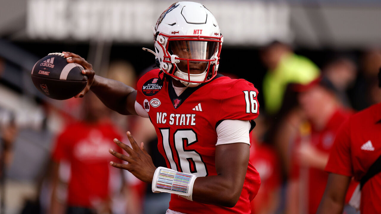 RALEIGH, NORTH CAROLINA - AUGUST 29: CJ Bailey #16 of the NC State Wolfpack warms up prior to their game against the Western Carolina Catamounts at Carter-Finley Stadium on August 29, 2024 in Raleigh, North Carolina.