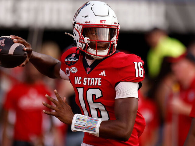 RALEIGH, NORTH CAROLINA - AUGUST 29: CJ Bailey #16 of the NC State Wolfpack warms up prior to their game against the Western Carolina Catamounts at Carter-Finley Stadium on August 29, 2024 in Raleigh, North Carolina.