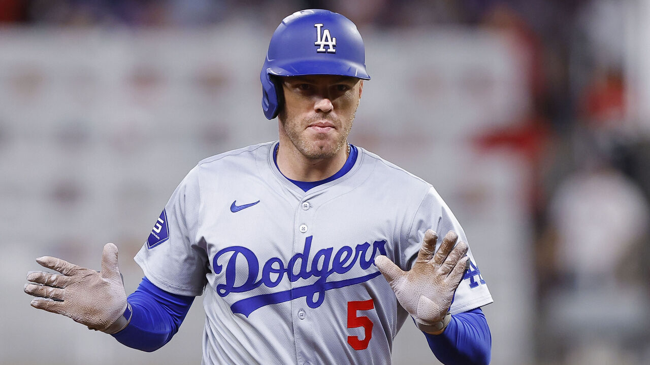 ATLANTA, GEORGIA - SEPTEMBER 16: Freddie Freeman #5 of the Los Angeles Dodgers reacts after hitting a three run home run during the seventh inning against the Atlanta Braves at Truist Park on September 16, 2024 in Atlanta, Georgia.