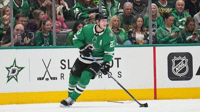 DALLAS, TX - FEBRUARY 26: Esa Lindell #23 of the Dallas Stars handles the puck against the New York Islanders at the American Airlines Center on February 26, 2024 in Dallas, Texas.