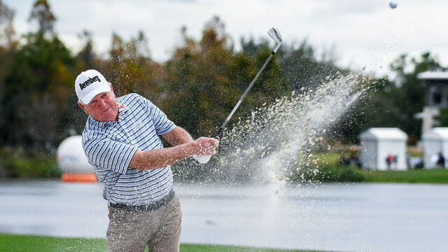 ORLANDO, FLORIDA, UNITED STATES - 2023/12/17: Mark O'Meara plays a bunker shot at the 18th green during the final round of the PNC Championship at the Ritz-Carlton Golf Club in Orlando, Florida. Bernhard Langer, and his son, Jason Langer won the 2023 PNC Championship.