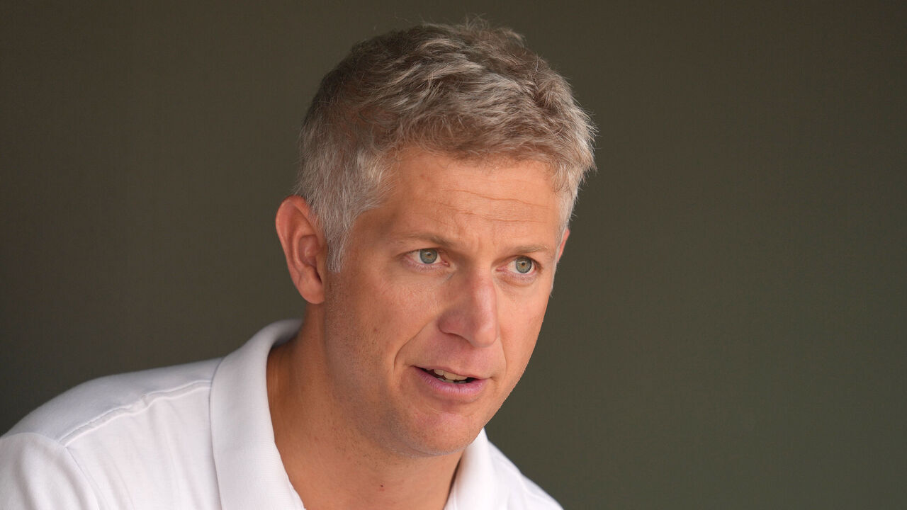 BALTIMORE, MD - AUGUST 24: Executive vice president and general manager Mike Elias of the Baltimore Orioles looks on during batting practice of a baseball game against the against the Houston Astros at Oriole Park at Camden Yards on August 24, 2024 in Baltimore, Maryland.