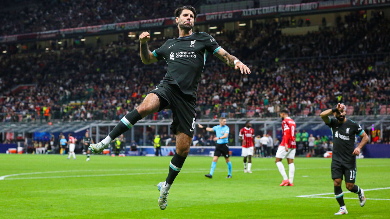 MILAN, ITALY - SEPTEMBER 17: Dominik Szoboszlai of Liverpool celebrates after scoring a goal during the UEFA Champions League 2024/25 League Phase MD1 match between AC Milan and Liverpool FC at Stadio San Siro on September 17, 2024 in Milan, Italy.