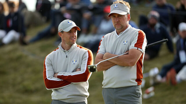 KOHLER, WISCONSIN - SEPTEMBER 25: Ian Poulter of England and team Europe and Rory McIlroy of Northern Ireland and team Europe look on over the 11th green during Saturday Afternoon Fourball Matches of the 43rd Ryder Cup at Whistling Straits on September 25, 2021 in Kohler, Wisconsin.