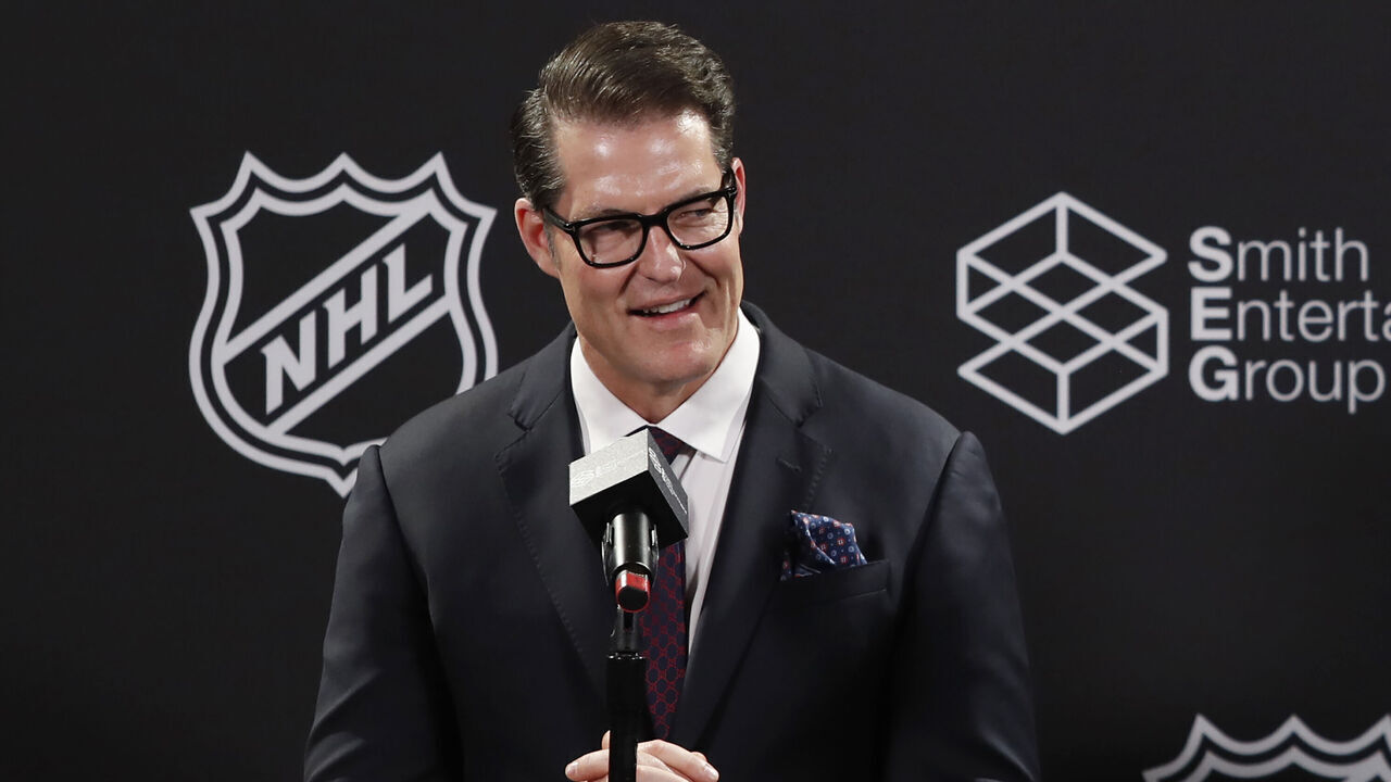 SALT LAKE CITY, UT - APRIL 24: General manager Bill Armstrong of the yet to be named NHL Utah hockey team smiles as he and head coach Andre Tourigny (not in photo) speak during a news conference at the Delta Center on April 24, 2024 in Salt Lake City, Utah. The NHL has allowed the sale of the Arizona Coyotes and the team will relocate to Salt Lake City, Utah.
