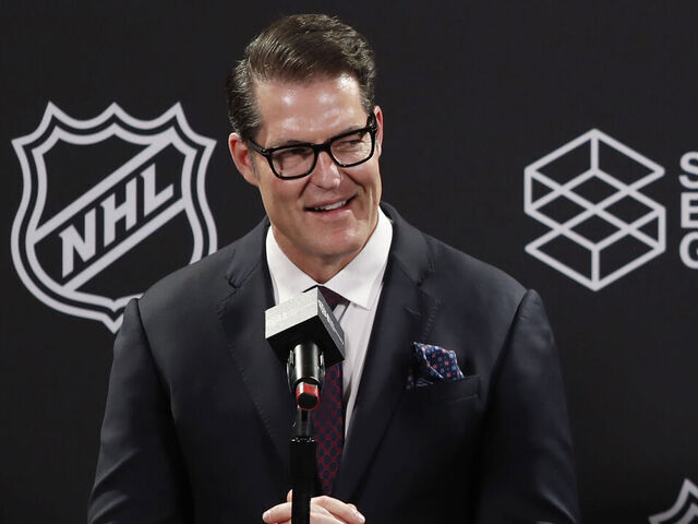 SALT LAKE CITY, UT - APRIL 24: General manager Bill Armstrong of the yet to be named NHL Utah hockey team smiles as he and head coach Andre Tourigny (not in photo) speak during a news conference at the Delta Center on April 24, 2024 in Salt Lake City, Utah. The NHL has allowed the sale of the Arizona Coyotes and the team will relocate to Salt Lake City, Utah.