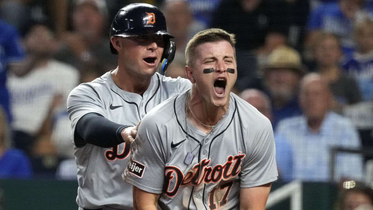 KANSAS CITY, MISSOURI - SEPTEMBER 18: Jace Jung #17 and Spencer Torkelson #20 of the Detroit Tigers celebrate after scoring on a two-run double by Trey Sweeney in the third inning at Kauffman Stadium on September 18, 2024 in Kansas City, Missouri.