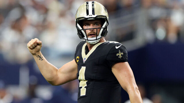 ARLINGTON, TEXAS - SEPTEMBER 15: Derek Carr #4 of the New Orleans Saints celebrates a touchdown pass during the third quarter against the Dallas Cowboys at AT&T Stadium on September 15, 2024 in Arlington, Texas.