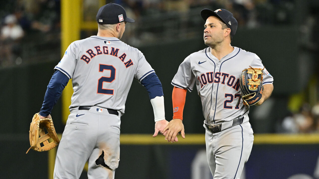SEATTLE, WASHINGTON - JULY 19: Alex Bregman #2 and Jose Altuve #27 of the Houston Astros shakes hands after the game against the Seattle Mariners at T-Mobile Park on July 19, 2024 in Seattle, Washington. The Houston Astros won 3-0.