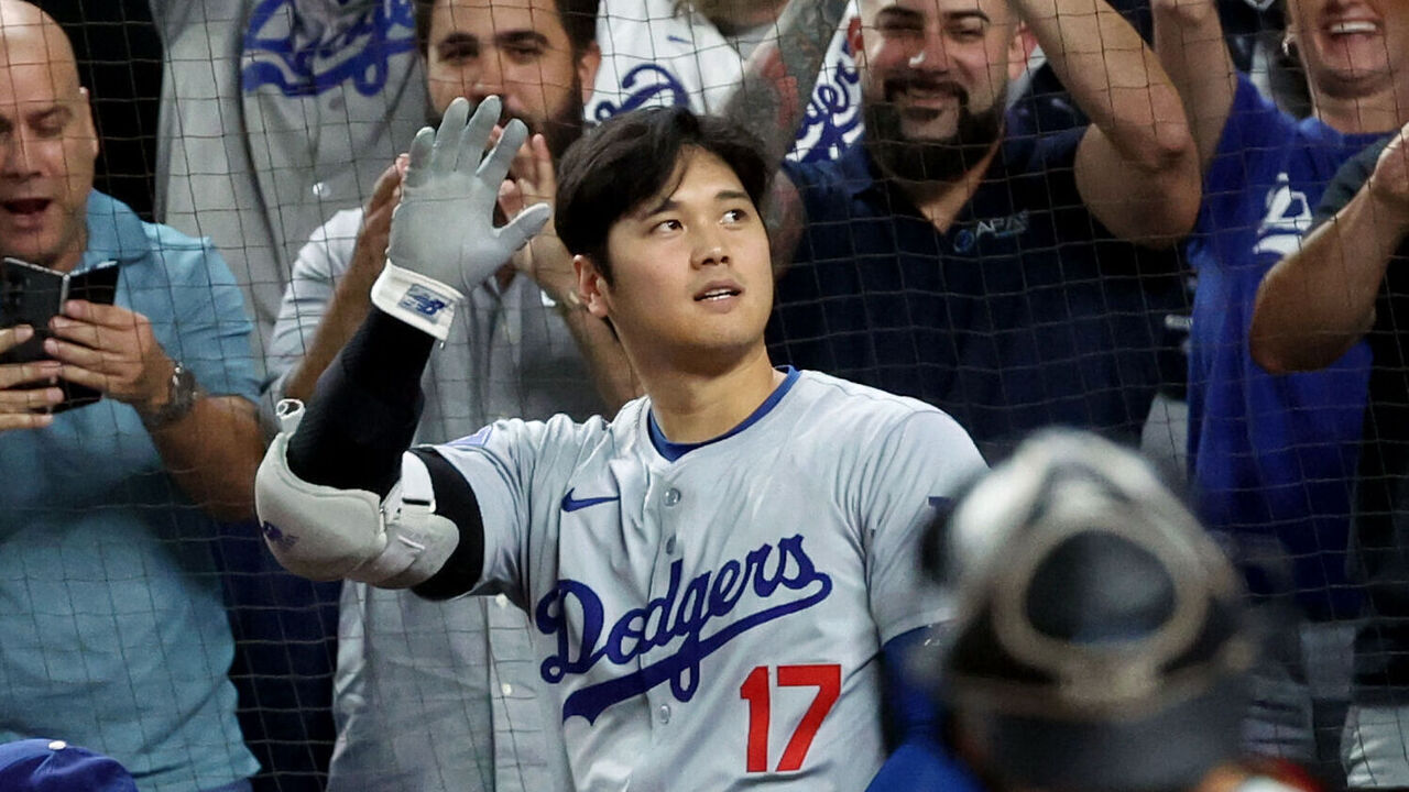 MIAMI, FL - SEPTEMBER 19: Shohei Ohtani #17 of the Los Angeles Dodgers receives a standing ovation after hitting a three-run home run in the seventh inning to become the first player in Major League Baseball history to reach 50 Home Runs and 50 Stolen bases in a single season during the game between the Los Angeles Dodgers and the Miami Marlins at loanDepot park on Thursday, September 19, 2024 in Miami, Florida.