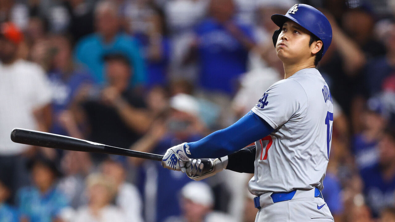 MIAMI, FLORIDA - SEPTEMBER 19: Shohei Ohtani #17 of the Los Angeles Dodgers hits a two-run home run, his 50th of the season, during the seventh inning against the Miami Marlins at loanDepot park on September 19, 2024 in Miami, Florida. Ohtani is now the first MLB player to have at least 50 home runs and 50 stolen bases in the same season.