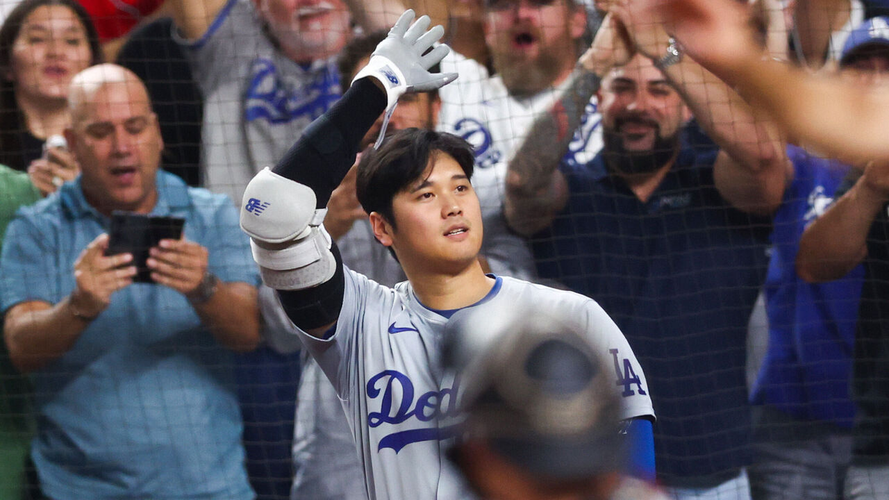 MIAMI, FLORIDA - SEPTEMBER 19: Shohei Ohtani #17 of the Los Angeles Dodgers celebrates after hitting a two-run home run, his 50th of the season, during the seventh inning against the Miami Marlins at loanDepot park on September 19, 2024 in Miami, Florida. Ohtani is now the first MLB player to have at least 50 home runs and 50 stolen bases in the same season.