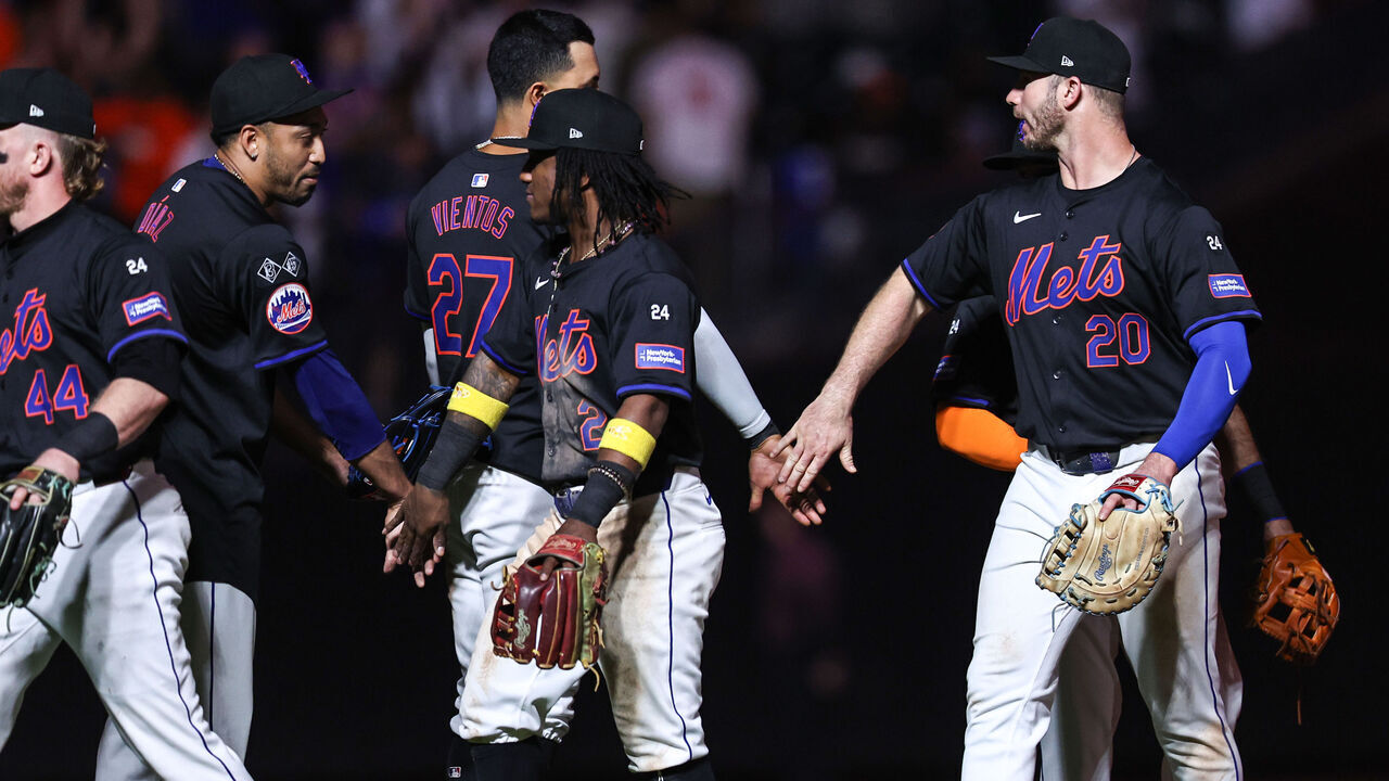 NEW YORK, NEW YORK - SEPTEMBER 19: Luisangel Acuña #2 of the New York Mets and Pete Alonso #20 of the New York Mets celebrate after defeating the Philadelphia Phillies 10-6 in the game at Citi Field on September 19, 2024 in New York City.