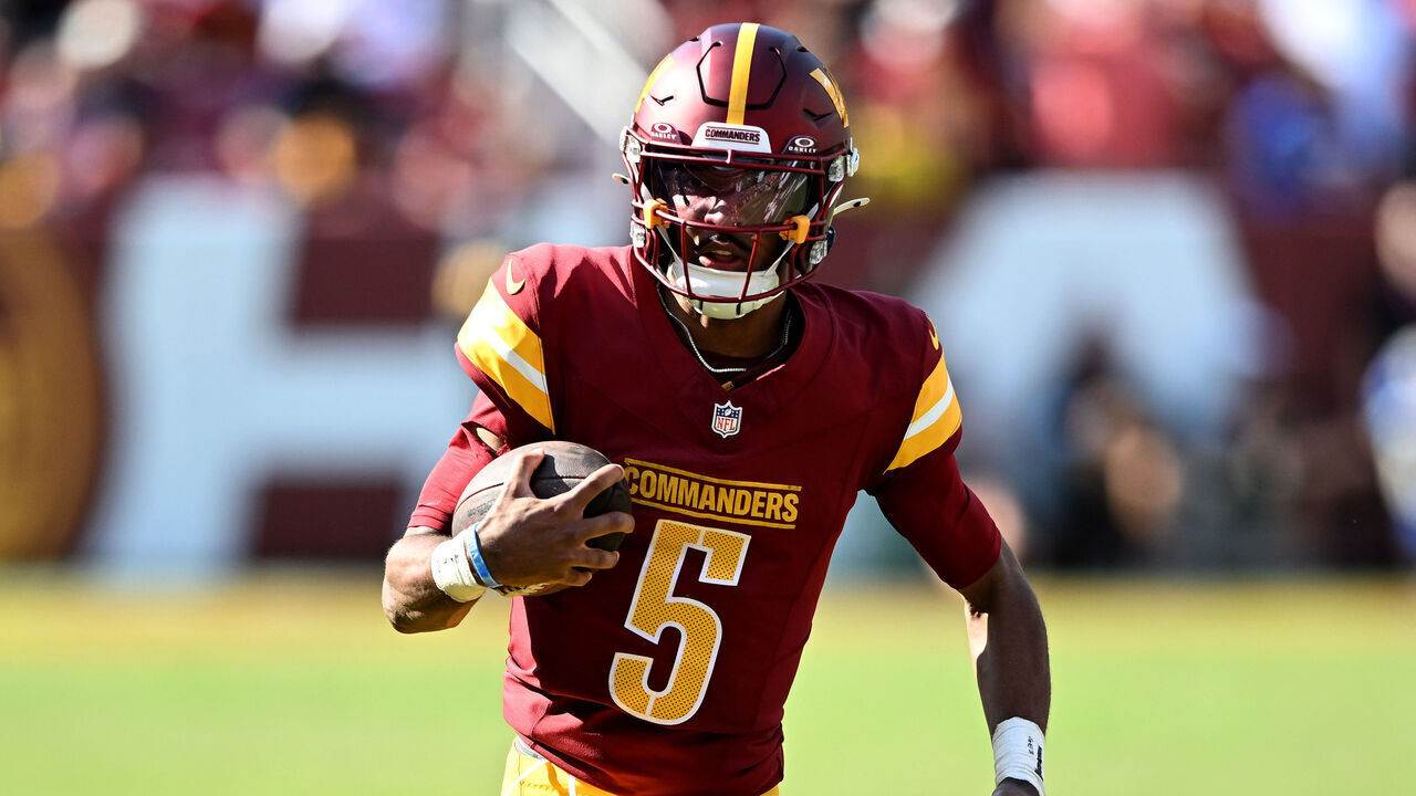 LANDOVER, MARYLAND - SEPTEMBER 15: Jayden Daniels #5 of the Washington Commanders runs with the ball against the New York Giants at Northwest Stadium on September 15, 2024 in Landover, Maryland.