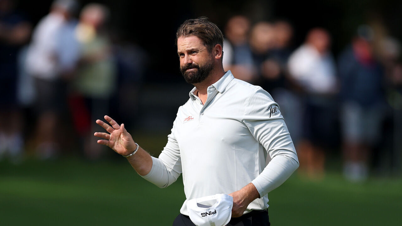 VIRGINIA WATER, ENGLAND - SEPTEMBER 20: Matthew Baldwin of England acknowledges the crowd on the 18th green during day two of the BMW PGA Championship 2024 at Wentworth Club on September 20, 2024 in Virginia Water, England.