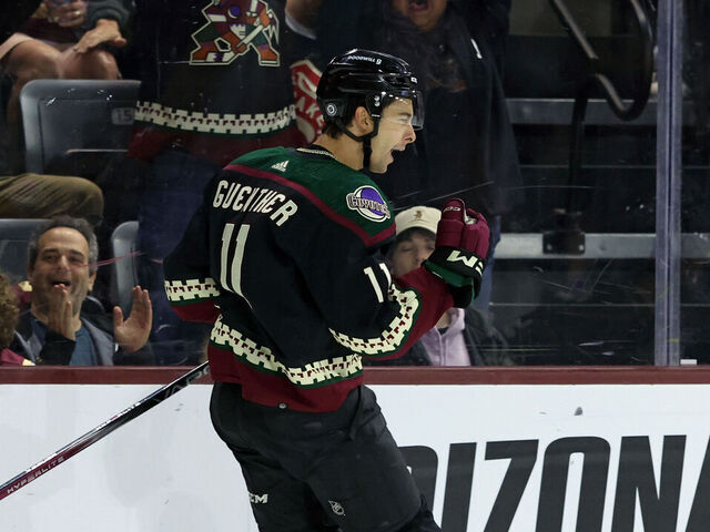 TEMPE, ARIZONA - MARCH 22: Dylan Guenther #11 of the Arizona Coyotes celebrates his game winning overtime goal against the Seattle Kraken at Mullett Arena on March 22, 2024 in Tempe, Arizona.