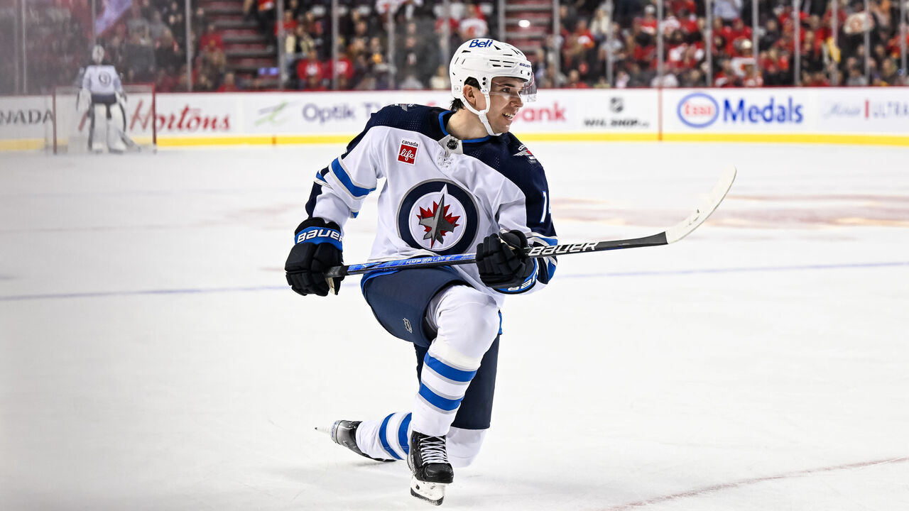 CALGARY, AB - OCTOBER 02: Winnipeg Jets Defenceman Ville Heinola (14) looks on after taking a shot during the second period of an NHL preseason game between the Calgary Flames and the Winnipeg Jets on October 2, 2023, at the Scotiabank Saddledome in Calgary, AB.