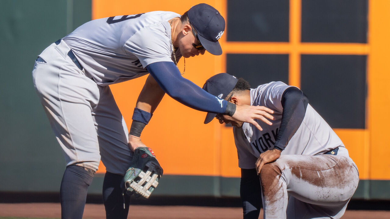 SEATTLE, WA - SEPTEMBER 19: Centerfielder Aaron Judge #99 of the New Yankees checks on right fielder Juan Soto #22 who collided with the wall in the seventh inning at T-Mobile Park on September 19, 2024 in Seattle, Washington.