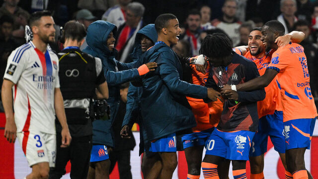 Marseille's players celebrate after winning the French L1 football match between Olympique Lyonnais (OL) and Olympique de Marseille at The Groupama Stadium in Decines-Charpieu, central-eastern France, on September 22, 2024.