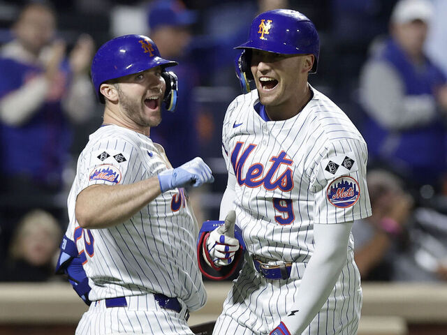 NEW YORK, NEW YORK - SEPTEMBER 22: Brandon Nimmo #9 of the New York Mets celebrates his sixth inning home run against the Philadelphia Phillies with teammate Pete Alonso #20 at Citi Field on September 22, 2024 in New York City.