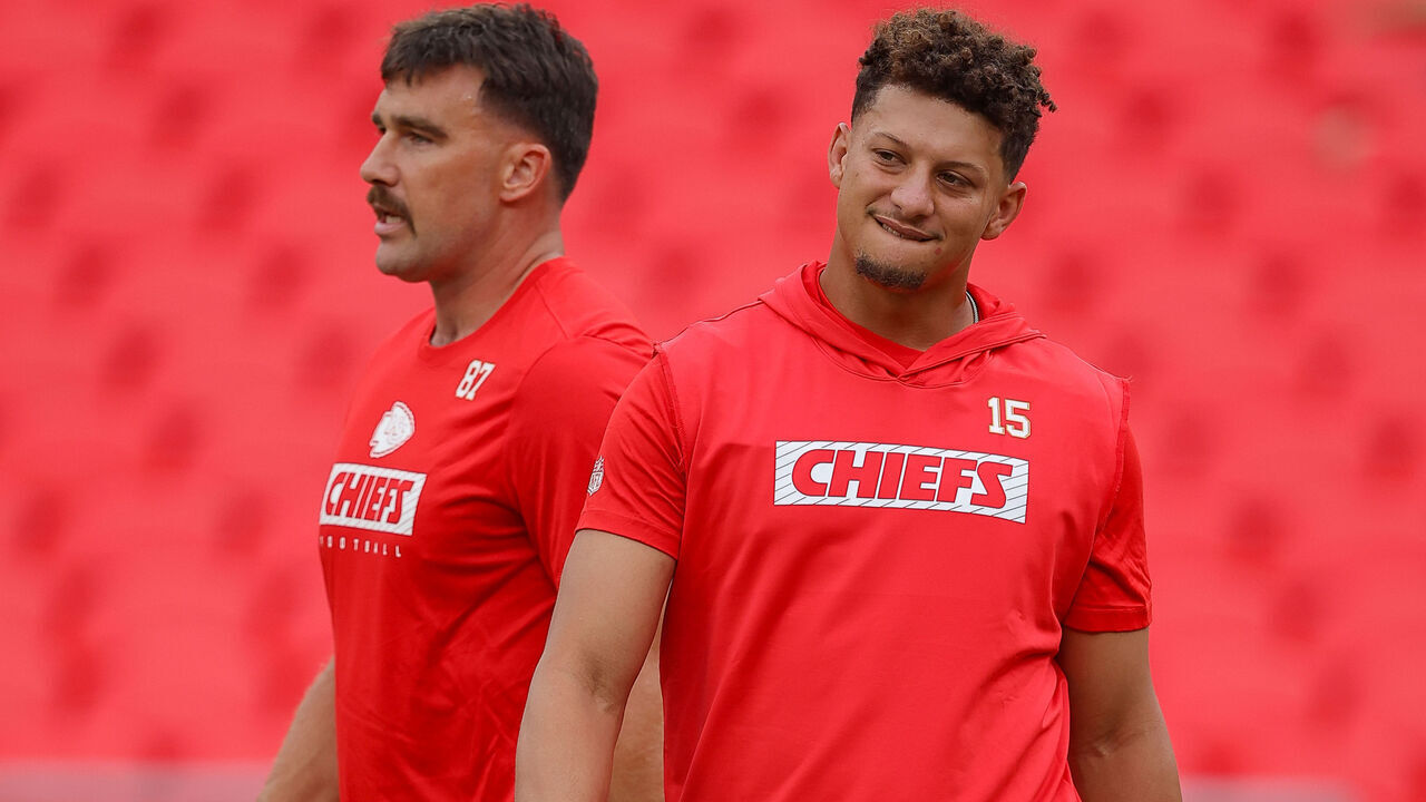 KANSAS CITY, MISSOURI - AUGUST 22: Travis Kelce #87 of the Kansas City Chiefs and Patrick Mahomes #15 of the Kansas City Chiefs take part during pregame warmups prior to a preseason game against the Chicago Bears at GEHA Field at Arrowhead Stadium on August 22, 2024 in Kansas City, Missouri.