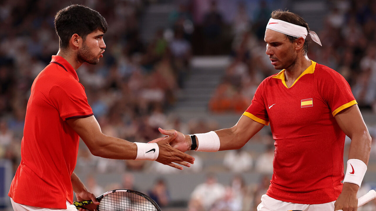 PARIS, FRANCE - JULY 31: Rafael Nadal of Team Spain (R) and Carlos Alcaraz of Team Spain interact against Austin Krajicek of Team United States and Rajeev Ram of Team United States during the Men's Doubles Quarter-final match on day five of the Olympic Games Paris 2024 at Roland Garros on July 31, 2024 in Paris, France.