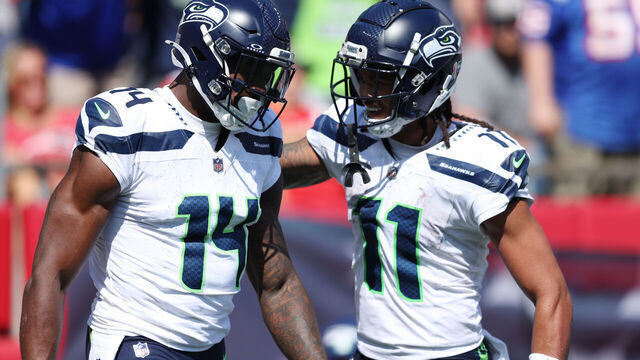 FOXBOROUGH, MASSACHUSETTS - SEPTEMBER 15: DK Metcalf #14 of the Seattle Seahawks reacts with Jaxon Smith-Njigba #11 during the game against the New England Patriots at Gillette Stadium on September 15, 2024 in Foxborough, Massachusetts.