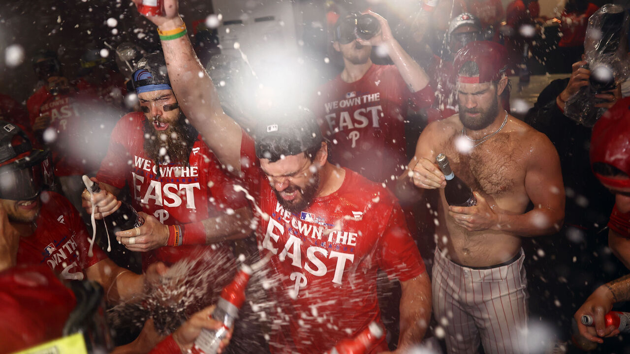 PHILADELPHIA, PENNSYLVANIA - SEPTEMBER 23: Kyle Schwarber #12 of the Philadelphia Phillies reacts with teammates after the Philadelphia Phillies clinch the 2024 NL East Division at Citizens Bank Park on September 23, 2024 in Philadelphia, Pennsylvania.
